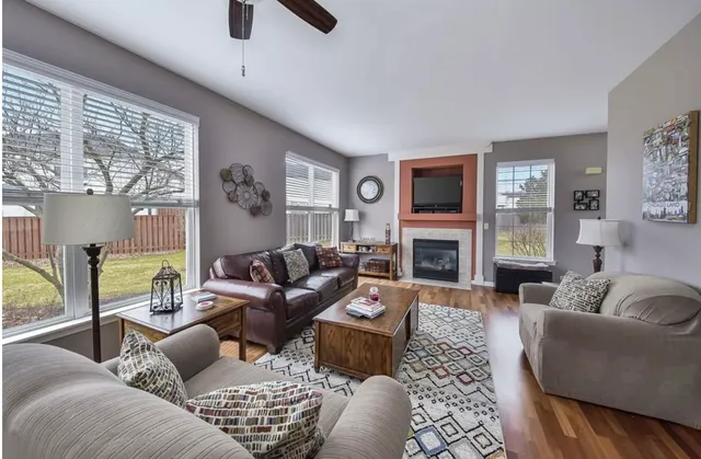 a living room with furniture and a fireplace