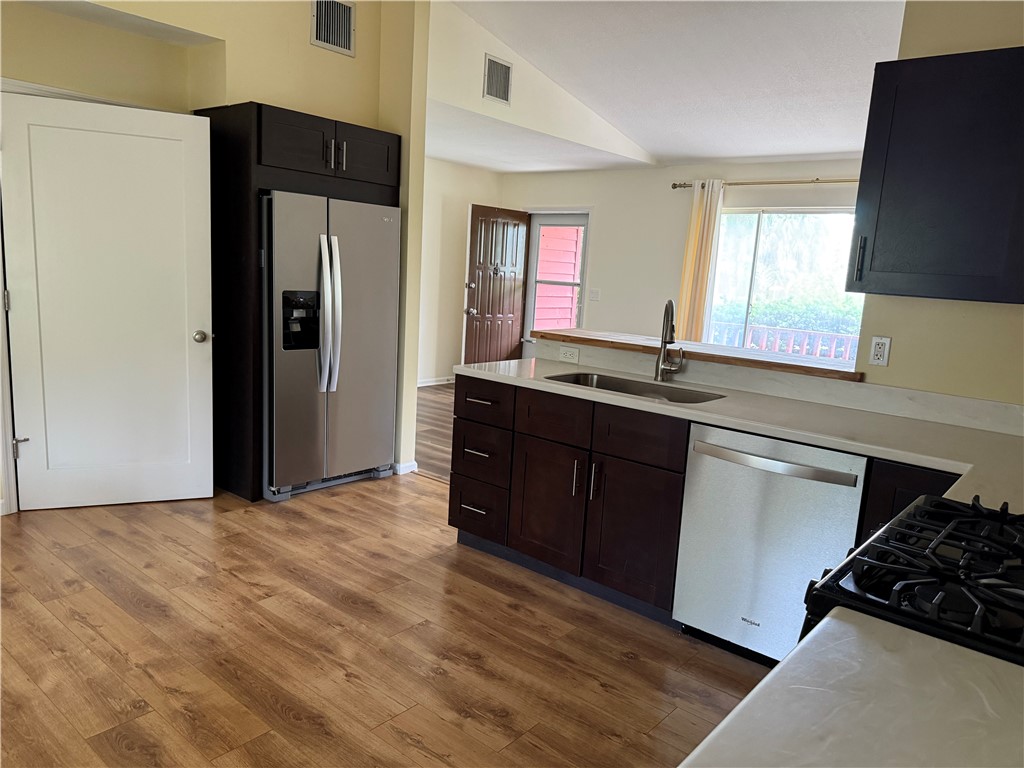 608 Stevenson Avenue Sebastian, FL 32958 - Photo 13 of 22 a kitchen with stainless steel appliances granite countertop a refrigerator and a sink