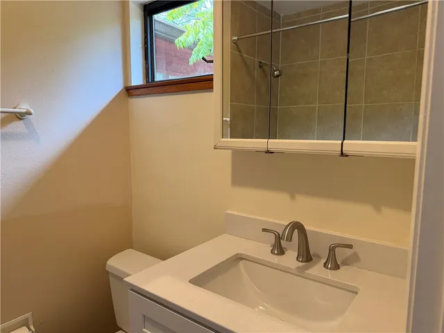 a bathroom with a sink and mirror