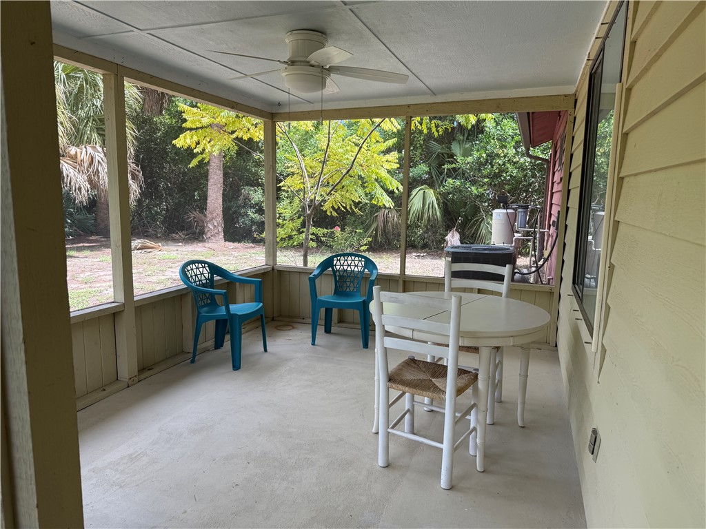 608 Stevenson Avenue Sebastian, FL 32958 - Photo 9 of 22 a dining room with furniture and a floor to ceiling window
