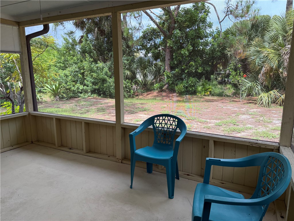 608 Stevenson Avenue Sebastian, FL 32958 - Photo 10 of 22 a backyard of a house with yard and outdoor seating