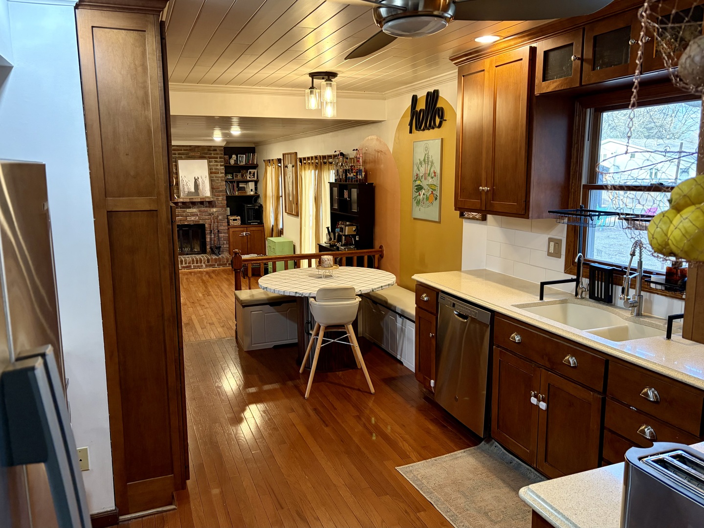 66 Holiday Drive Clinton, IL 61727 - Photo 15 of 43 a dining hall with stainless steel appliances granite countertop a sink dishwasher and a refrigerator with wooden floor