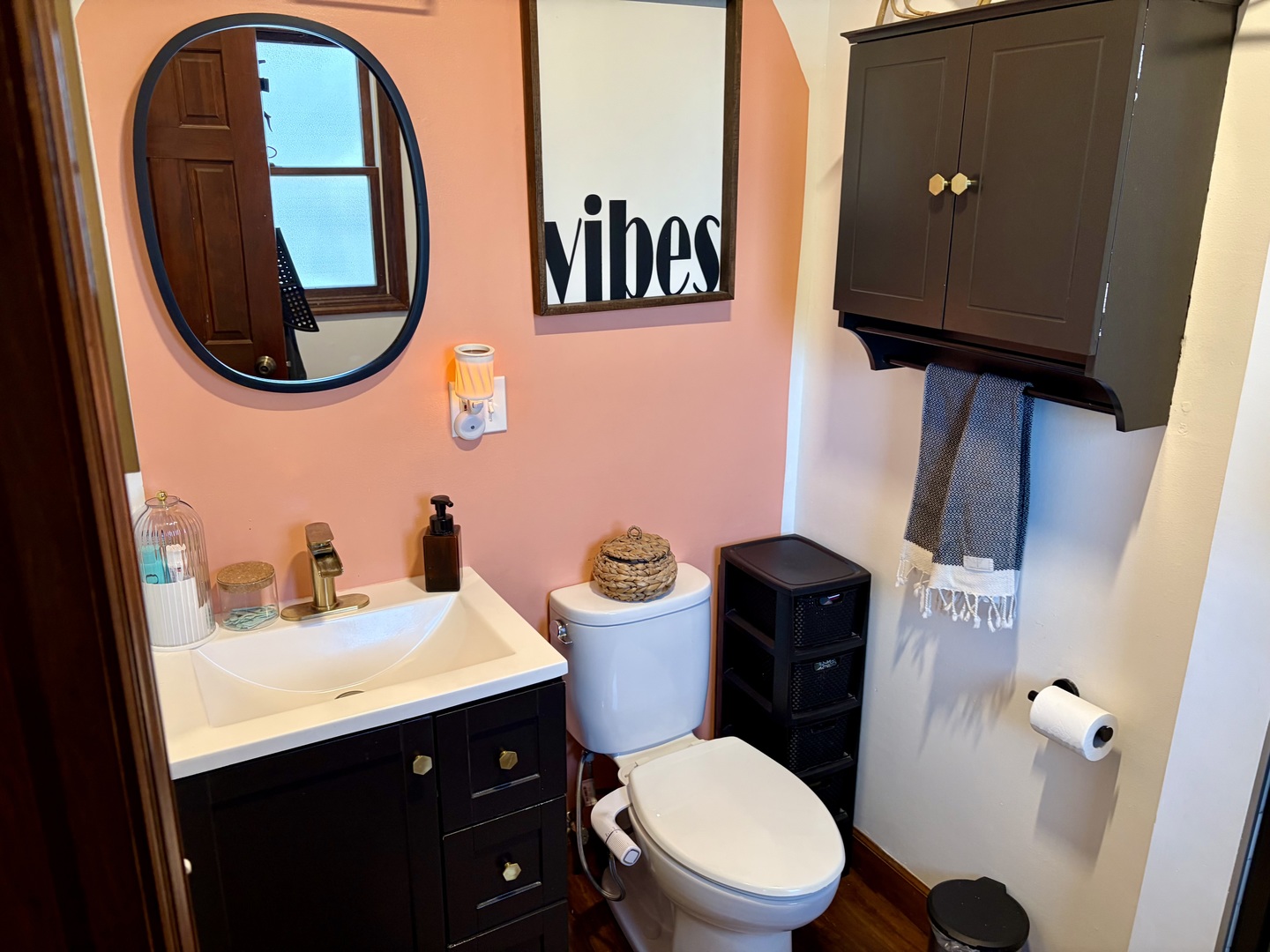 66 Holiday Drive Clinton, IL 61727 - Photo 36 of 43 a bathroom with a toilet a sink and a mirror