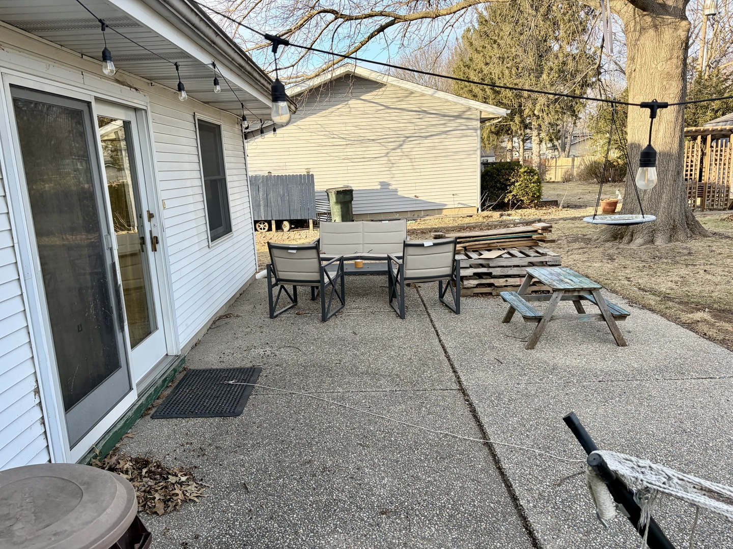 66 Holiday Drive Clinton, IL 61727 - Photo 37 of 43 a view of a patio with table and chairs