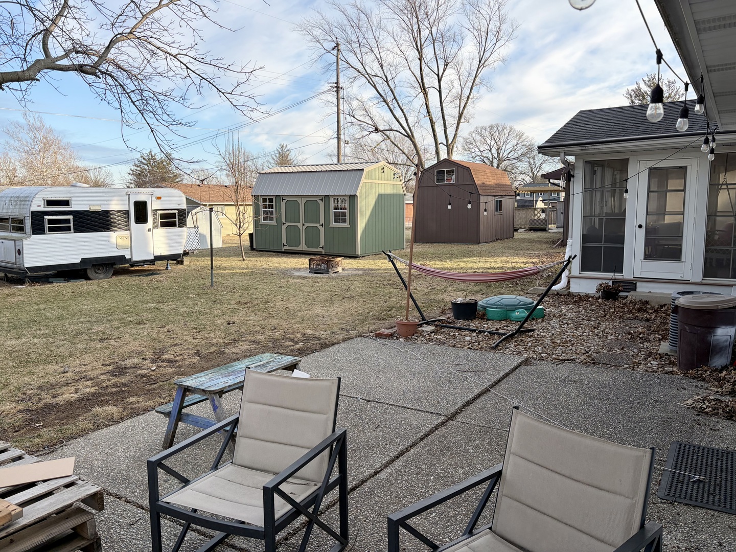 66 Holiday Drive Clinton, IL 61727 - Photo 39 of 43 a view of a house with backyard and sitting area
