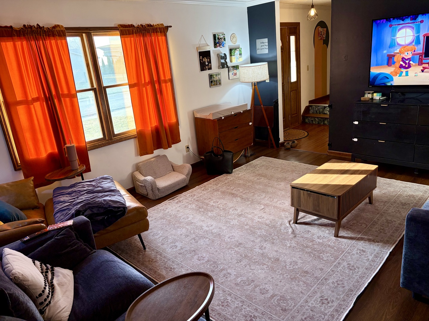 66 Holiday Drive Clinton, IL 61727 - Photo 6 of 43 a living room with furniture a flat screen tv and a fireplace