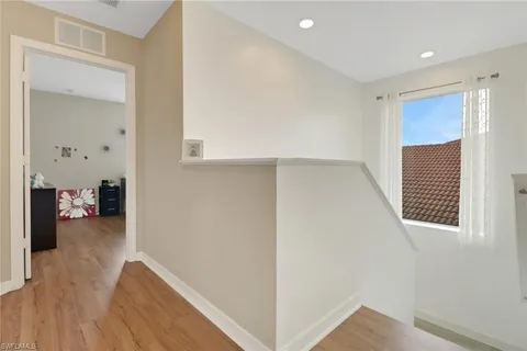 a view of livingroom with hardwood floor and hallway