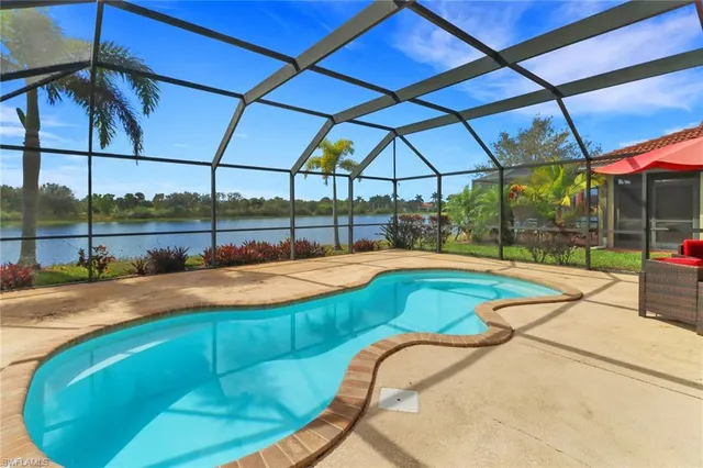 a view of a swimming pool with a patio