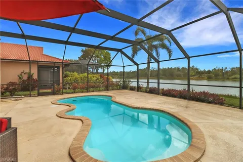 a swimming pool with an outdoor seating