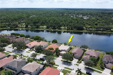 an aerial view of a house with a lake view