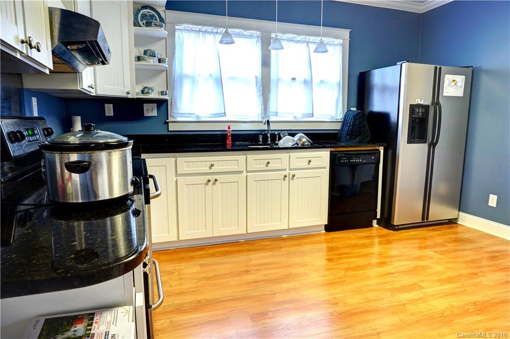 2425 Chesnee Road Columbus, NC 28722 - Photo 15 of 35 a kitchen with stainless steel appliances granite countertop a stove a refrigerator and a sink
