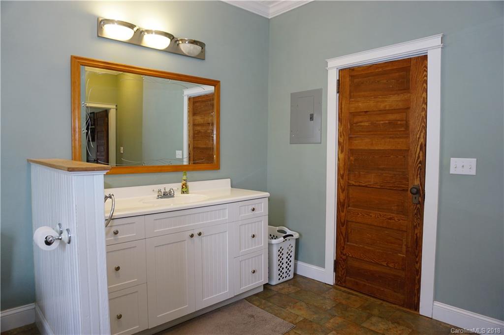 2425 Chesnee Road Columbus, NC 28722 - Photo 17 of 35 a bathroom with a sink a vanity and a mirror