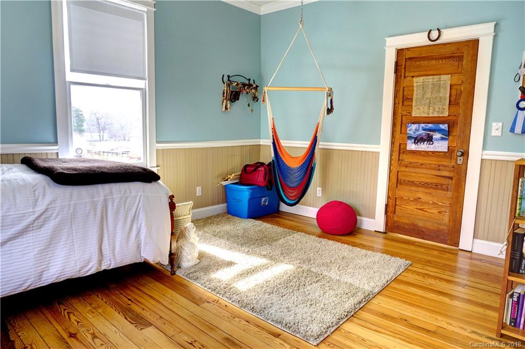 2425 Chesnee Road Columbus, NC 28722 - Photo 18 of 35 a bedroom with a bed and window