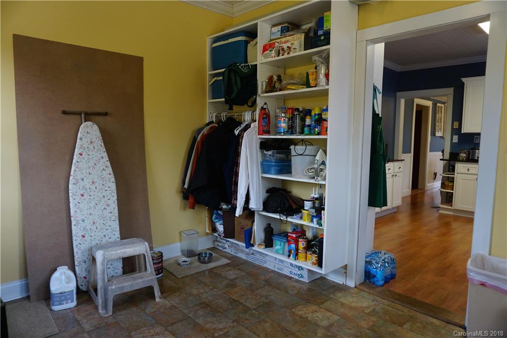 2425 Chesnee Road Columbus, NC 28722 - Photo 23 of 35 a living room with lots of furniture and a book shelf