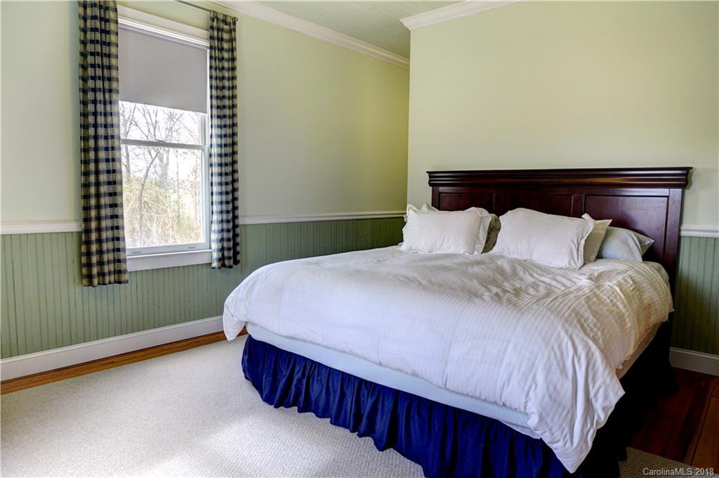 2425 Chesnee Road Columbus, NC 28722 - Photo 27 of 35 a bedroom with a bed and window