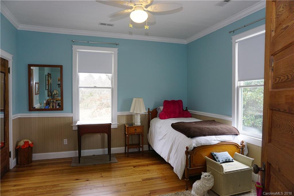 2425 Chesnee Road Columbus, NC 28722 - Photo 28 of 35 a bedroom with a bed and a window