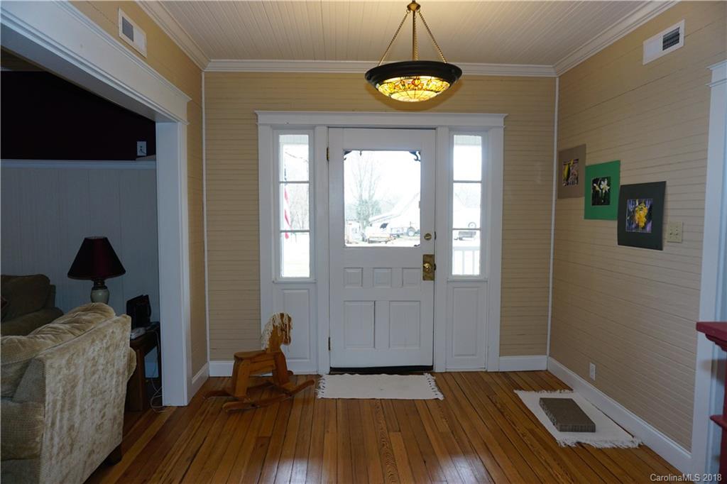 2425 Chesnee Road Columbus, NC 28722 - Photo 9 of 35 a view of empty room with wooden floor and fan