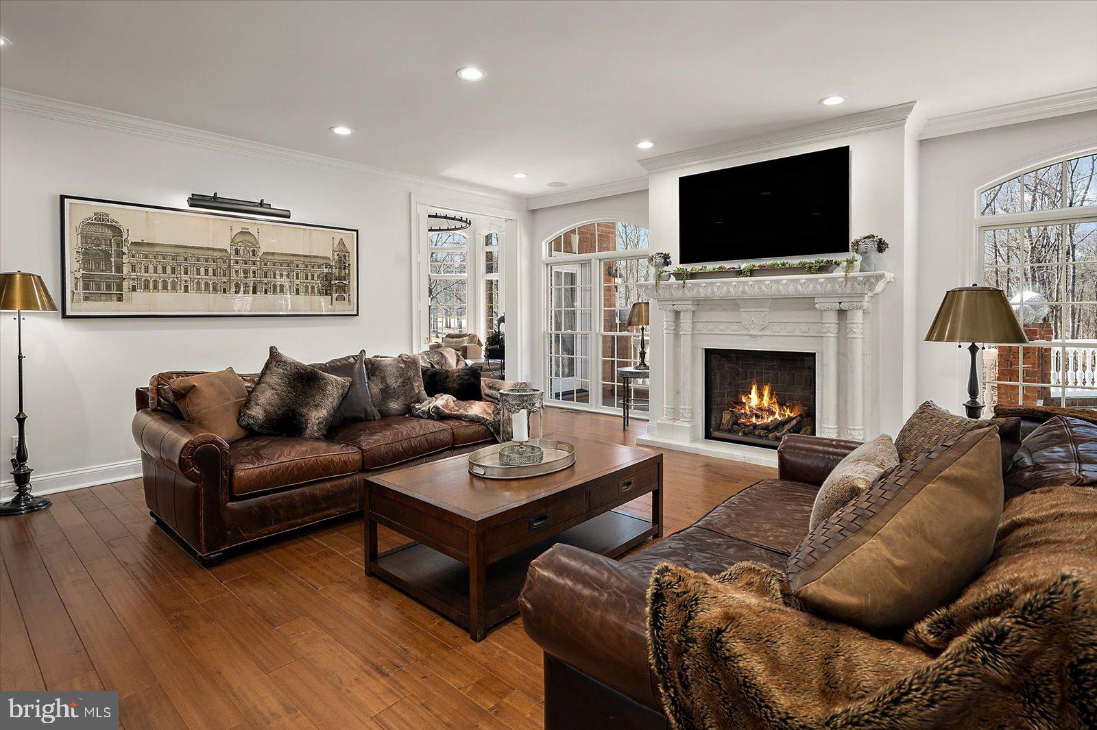 17 Perder Lane Edgewater, MD 21037 - Photo 15 of 115 a living room with furniture a fireplace and a flat screen tv