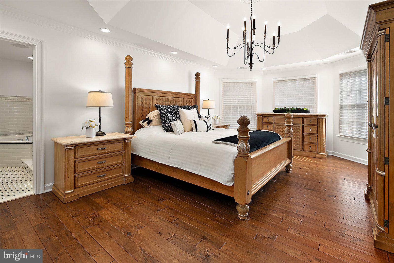 17 Perder Lane Edgewater, MD 21037 - Photo 53 of 115 a bedroom with a bed a chandelier and dresser