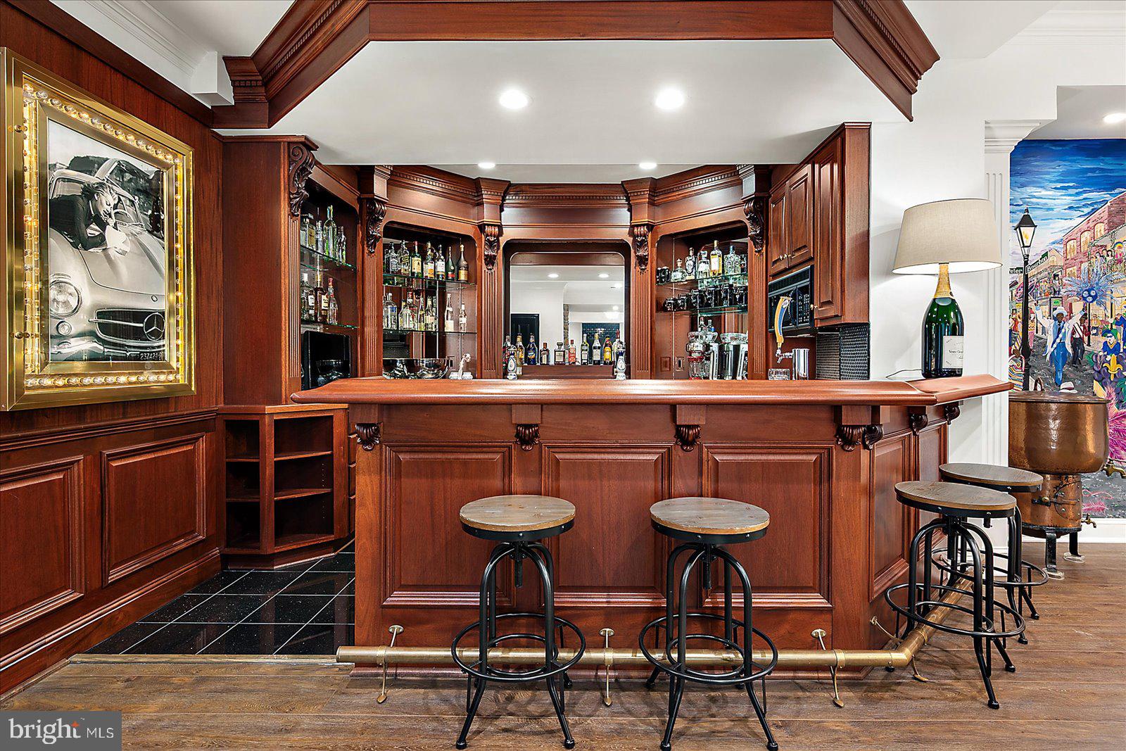 17 Perder Lane Edgewater, MD 21037 - Photo 66 of 115 a kitchen with stainless steel appliances granite countertop a stove a refrigerator a dining table and chairs with wooden floor