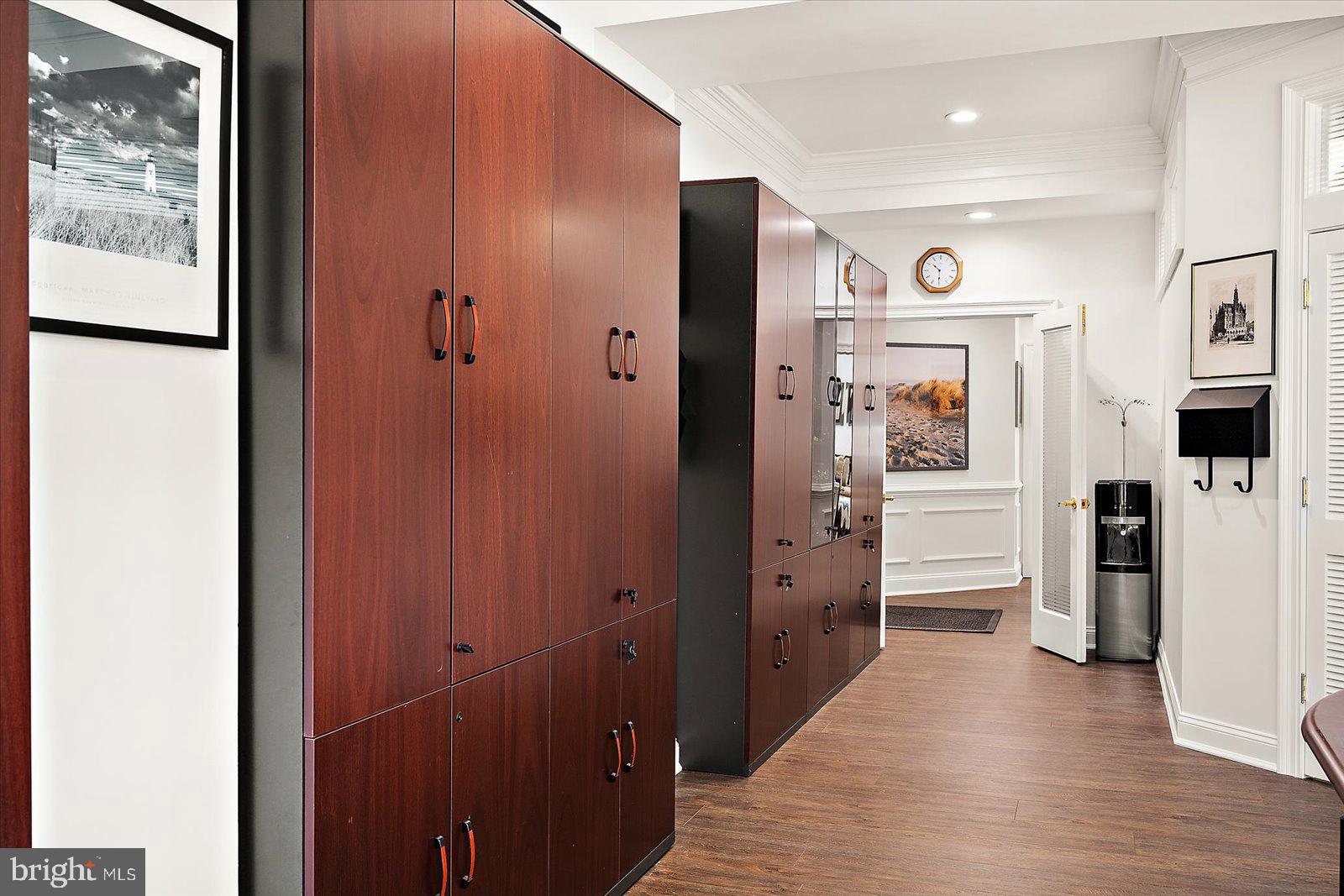 17 Perder Lane Edgewater, MD 21037 - Photo 73 of 115 a view of a hallway with lots of cabinet and mirrors