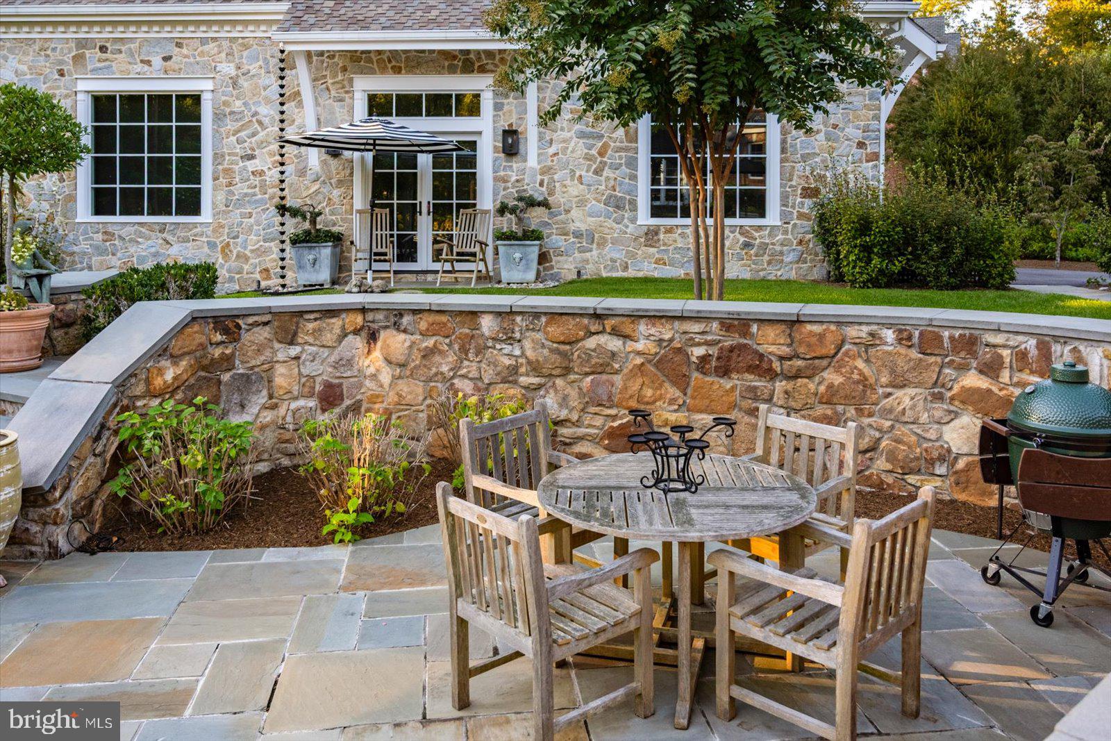 17 Perder Lane Edgewater, MD 21037 - Photo 81 of 115 a patio with table and chairs and potted plants