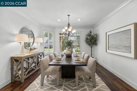 a dining room with furniture and window