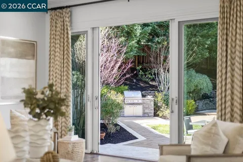a spacious bedroom with two beds and a large window