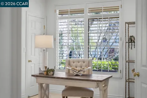 a bedroom with bed and window
