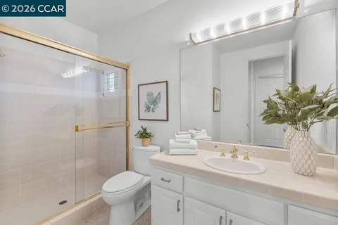 a bedroom with a bed and with a chandelier