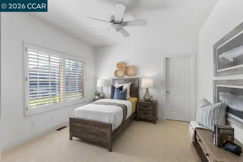 a aerial view of a house with swimming pool and large trees