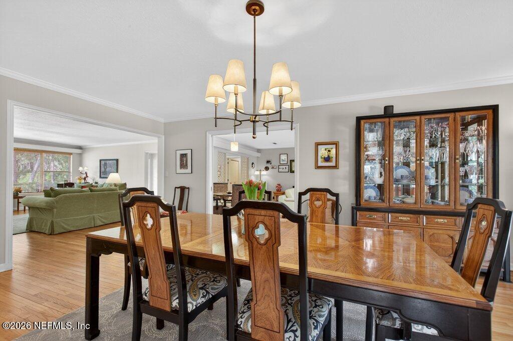 8349 Kim Road Jacksonville, FL 32217 - Photo 14 of 73 a view of a dining room with furniture window and wooden floor