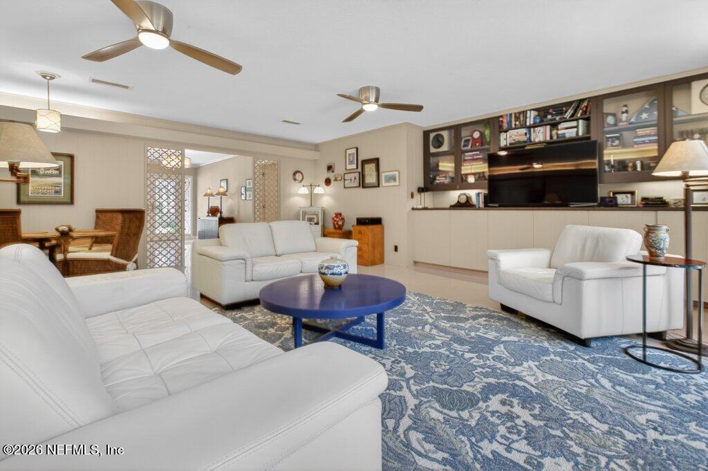 8349 Kim Road Jacksonville, FL 32217 - Photo 26 of 73 a living room with furniture and a flat screen tv