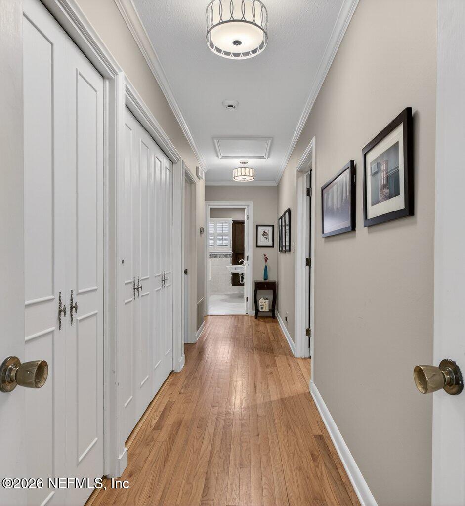 8349 Kim Road Jacksonville, FL 32217 - Photo 27 of 73 a view of a hallway with wooden floor and staircase
