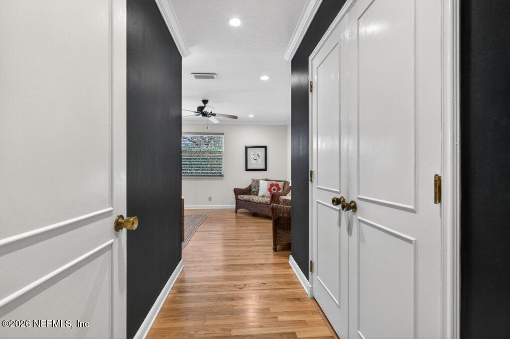 8349 Kim Road Jacksonville, FL 32217 - Photo 28 of 73 a view of a hallway with wooden floor and staircase