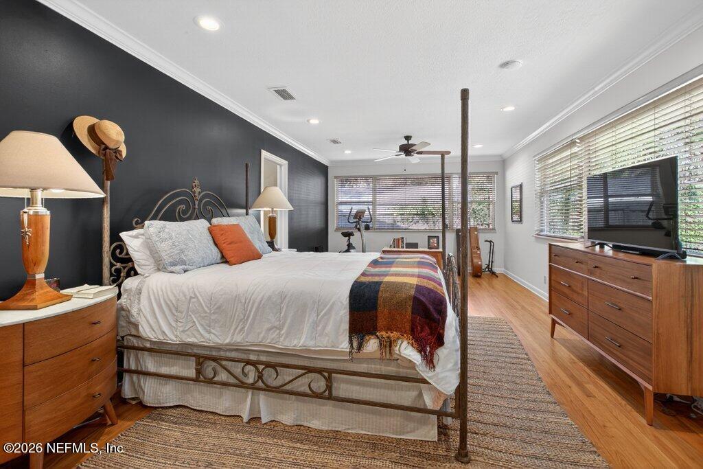 8349 Kim Road Jacksonville, FL 32217 - Photo 29 of 73 a spacious bedroom with a bed and a flat screen tv