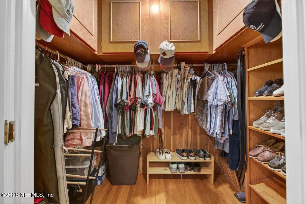 8349 Kim Road Jacksonville, FL 32217 - Photo 30 of 73 a view of walk in closet with clothes and shoes