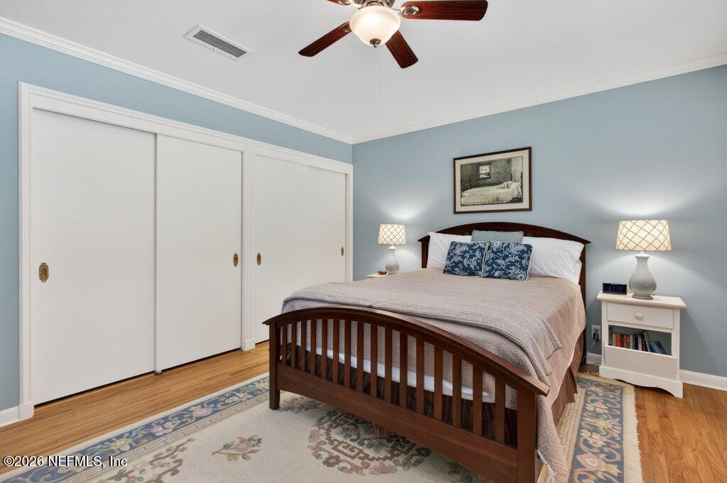 8349 Kim Road Jacksonville, FL 32217 - Photo 40 of 73 a bedroom with a bed and a chandelier