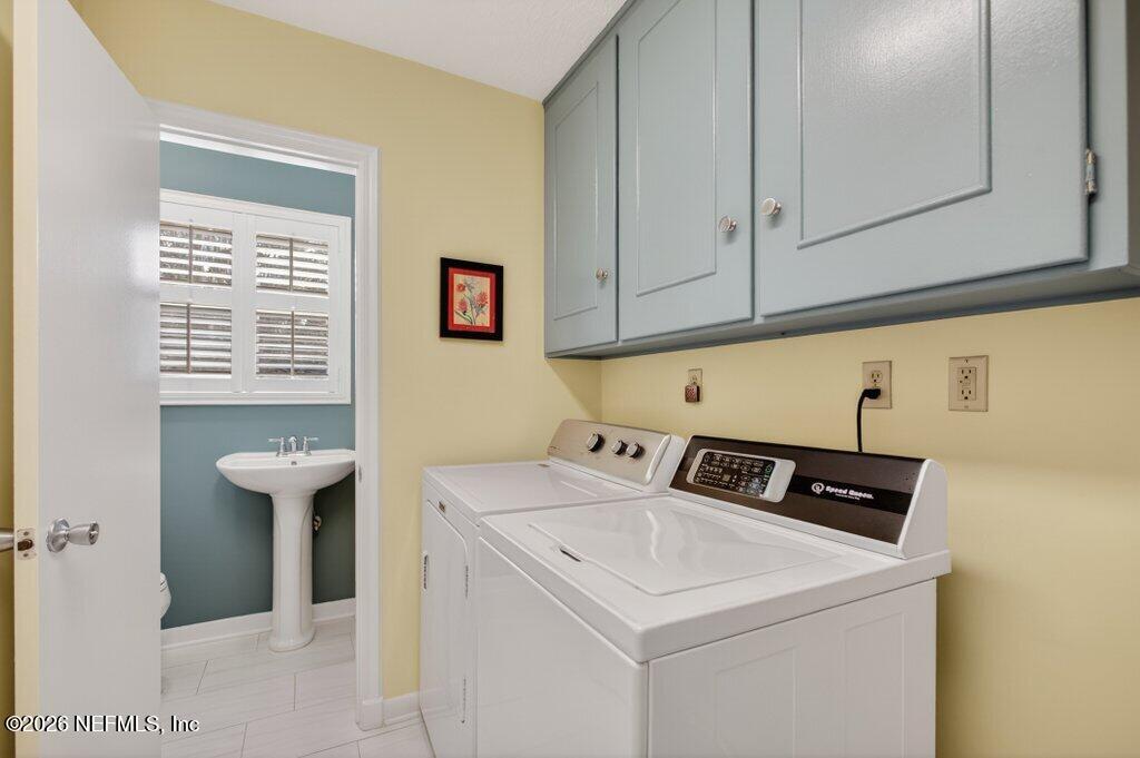 8349 Kim Road Jacksonville, FL 32217 - Photo 56 of 73 a view of utility room with washer and dryer