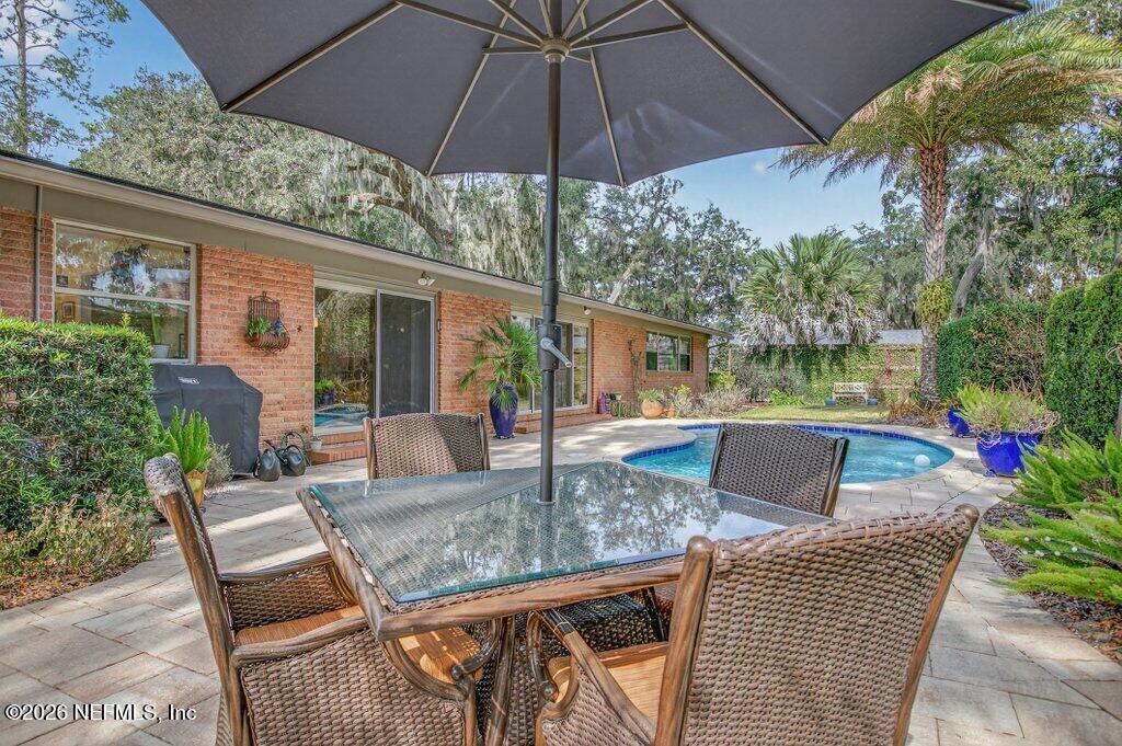 8349 Kim Road Jacksonville, FL 32217 - Photo 61 of 73 a view of backyard with seating space and yard