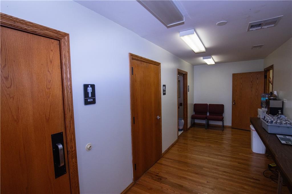 222 Rieger Road Butler, PA 16001 - Photo 12 of 41 a view of a hallway with wooden floor and furniture