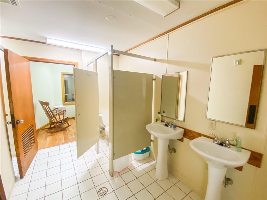 222 Rieger Road Butler, PA 16001 - Photo 14 of 41 a bathroom with a sink mirror toilet and shower