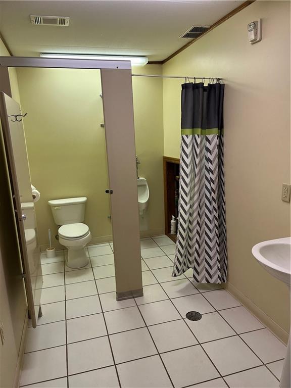 222 Rieger Road Butler, PA 16001 - Photo 16 of 41 a bathroom with a toilet and a shower