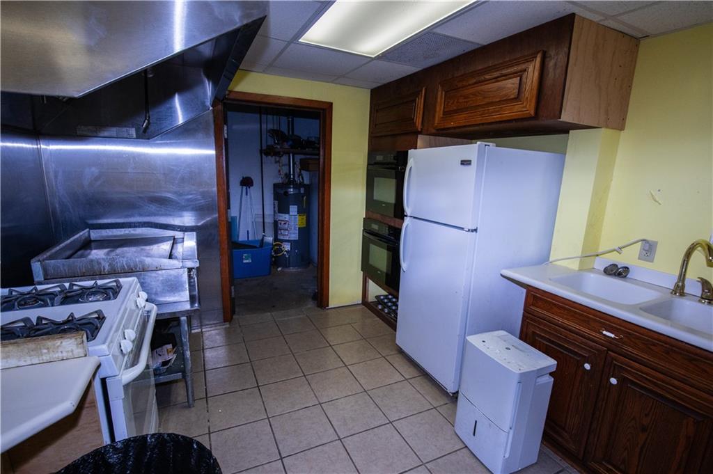 222 Rieger Road Butler, PA 16001 - Photo 26 of 41 a kitchen with cabinets and appliances
