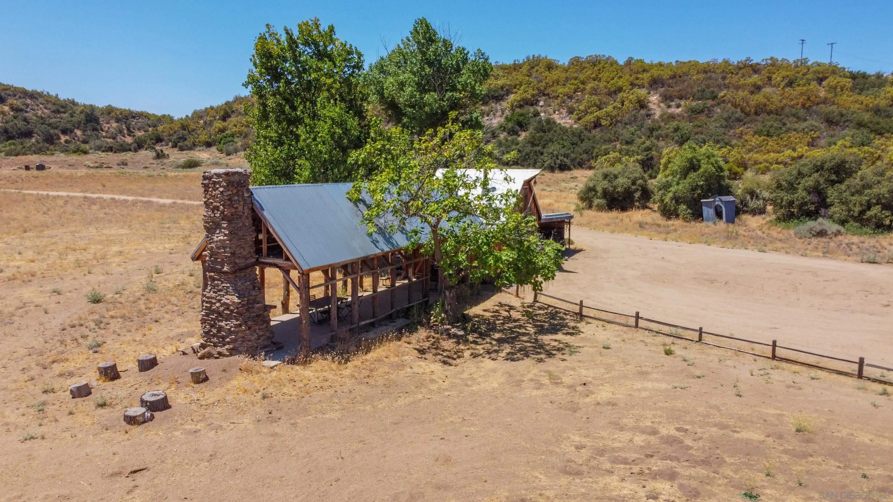 60815 Burnt Valley Road Anza, CA 92539 - Photo 17 of 40 a view of a dry yard with wooden fence