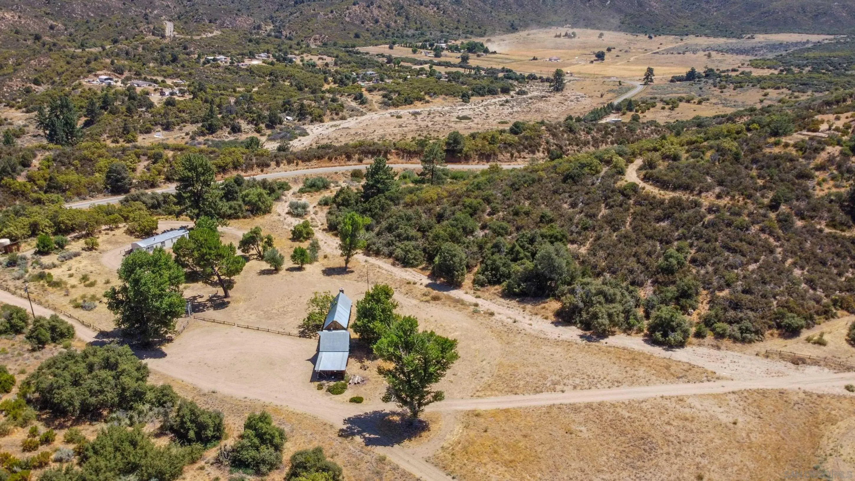 60815 Burnt Valley Road Anza, CA 92539 - Photo 22 of 40 a view of a yard with wooden fence