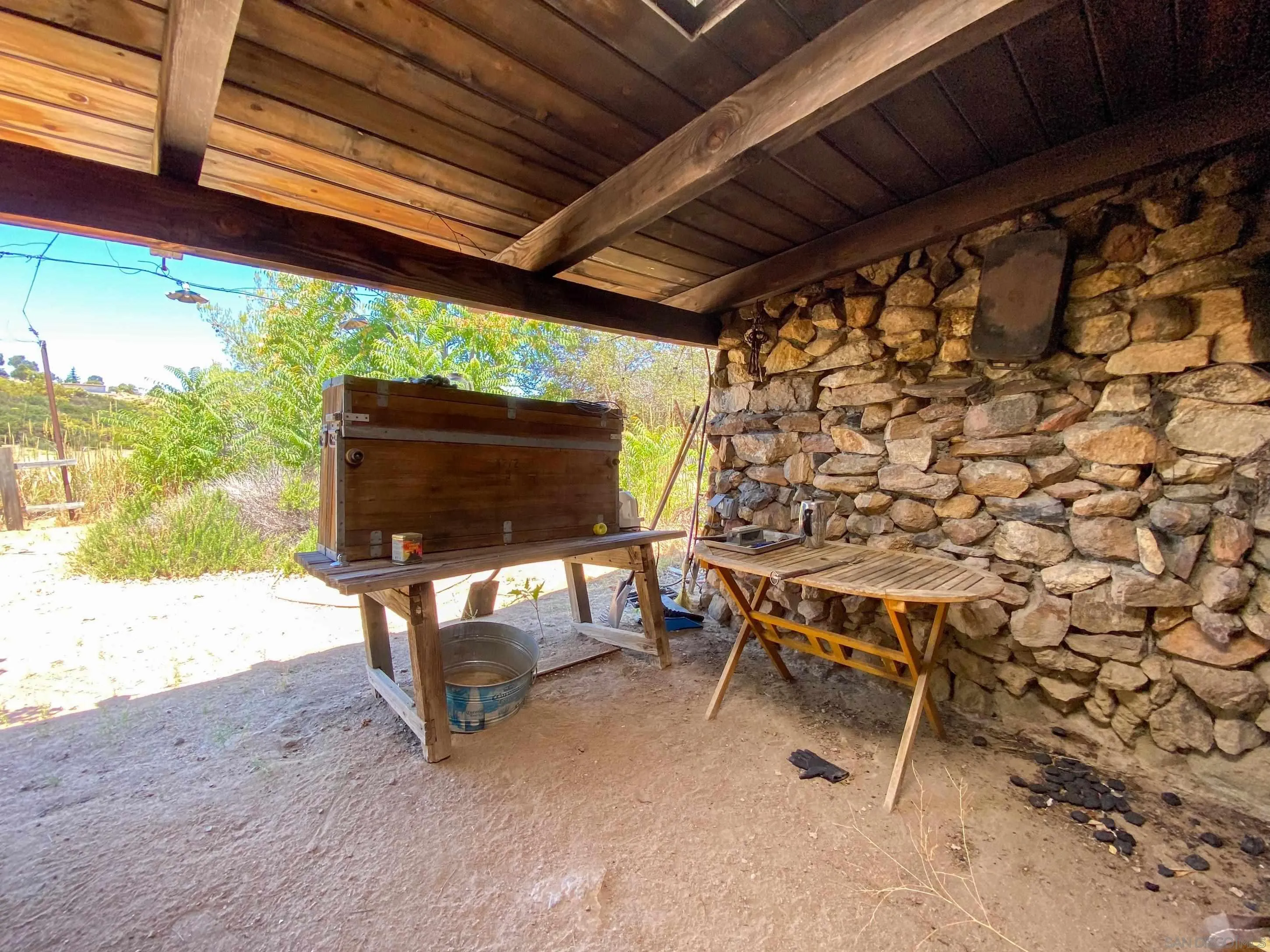 60815 Burnt Valley Road Anza, CA 92539 - Photo 30 of 40 a living room with a couch and a flat screen tv