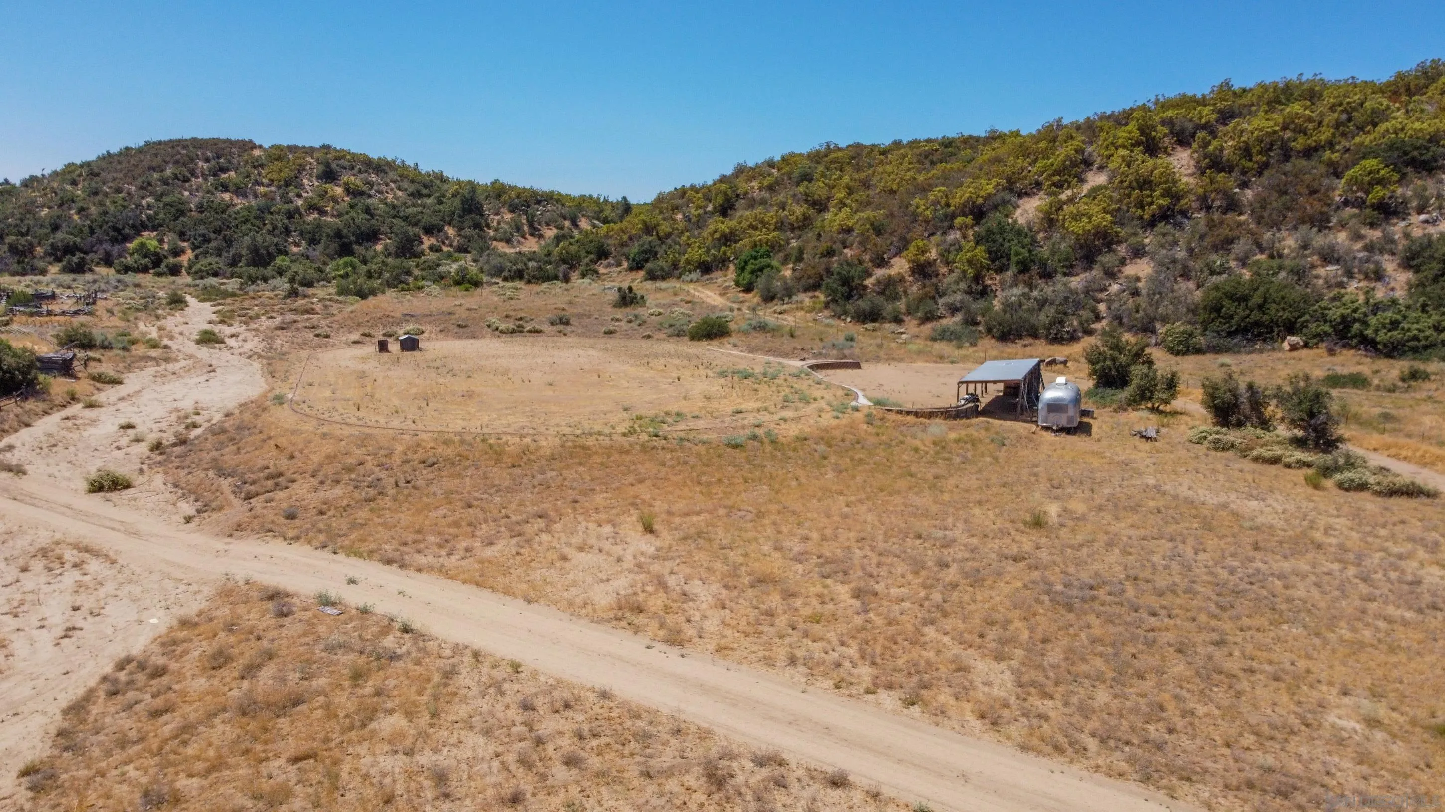 60815 Burnt Valley Road Anza, CA 92539 - Photo 34 of 40 a view of a dry field with mountains in the background