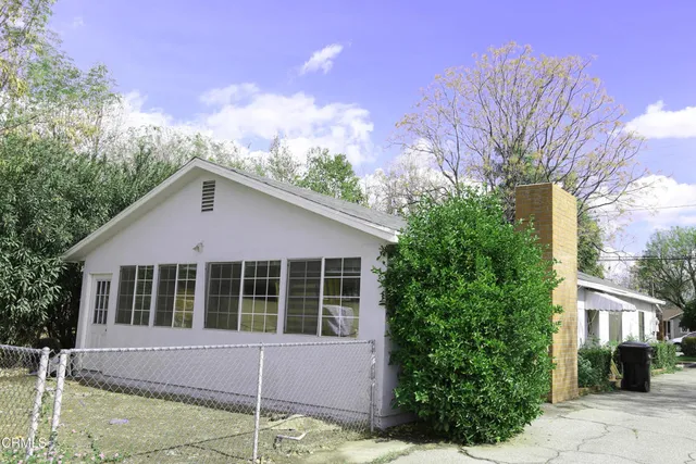 a house with trees in the background