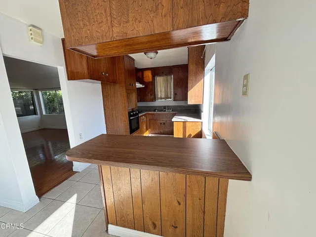 a view of kitchen and wooden floor
